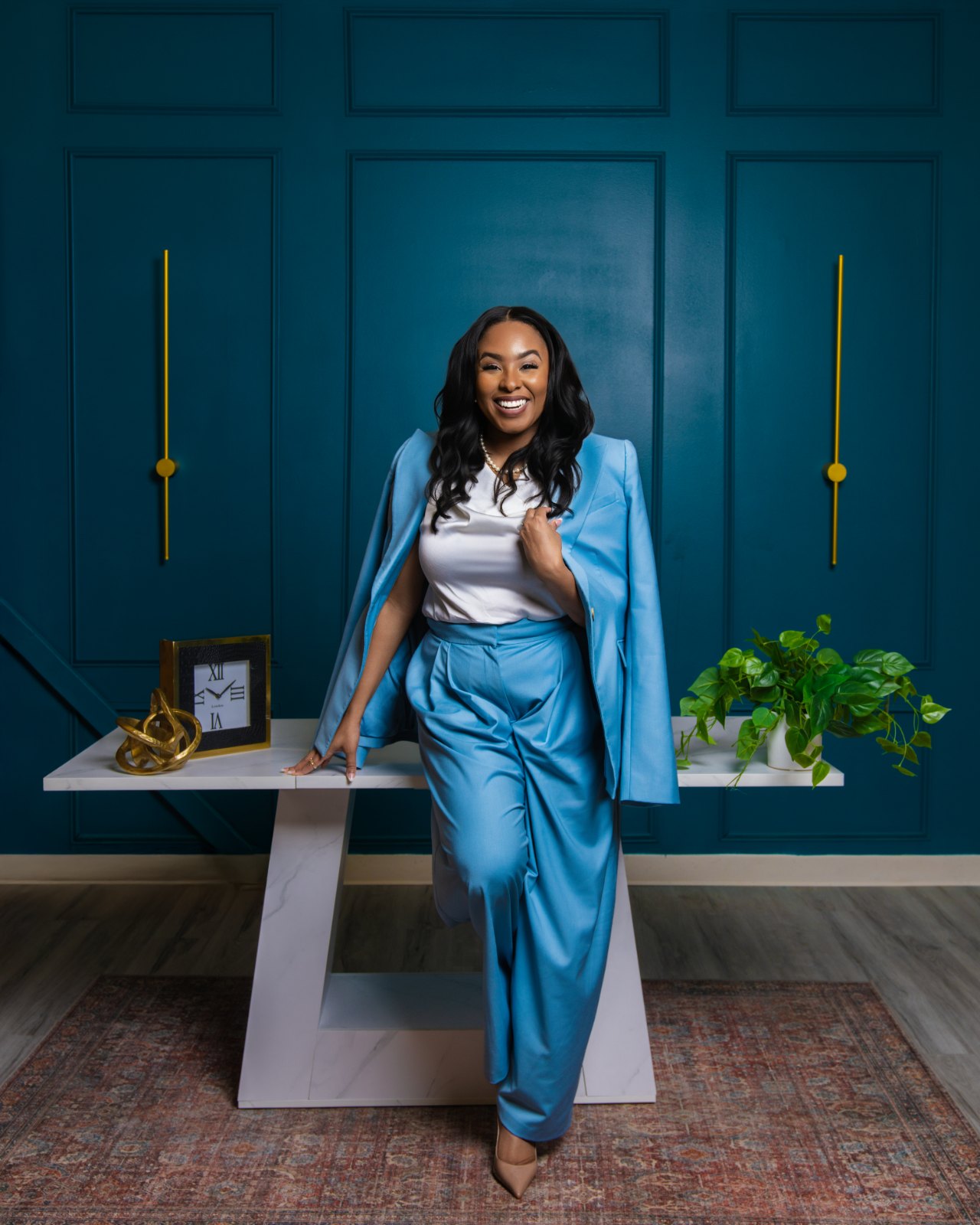 Dr. Desiree Strickland, founder of The Public Health Club, in a blue suit.